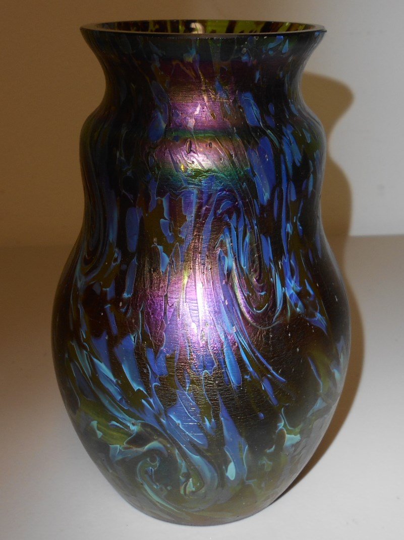 Bohemian Iridescent Vase: 6 1/2" Iridescent Bohemian vase. A beautiful mottled finish when held to the light resembles a tortious shell mottling in glass.