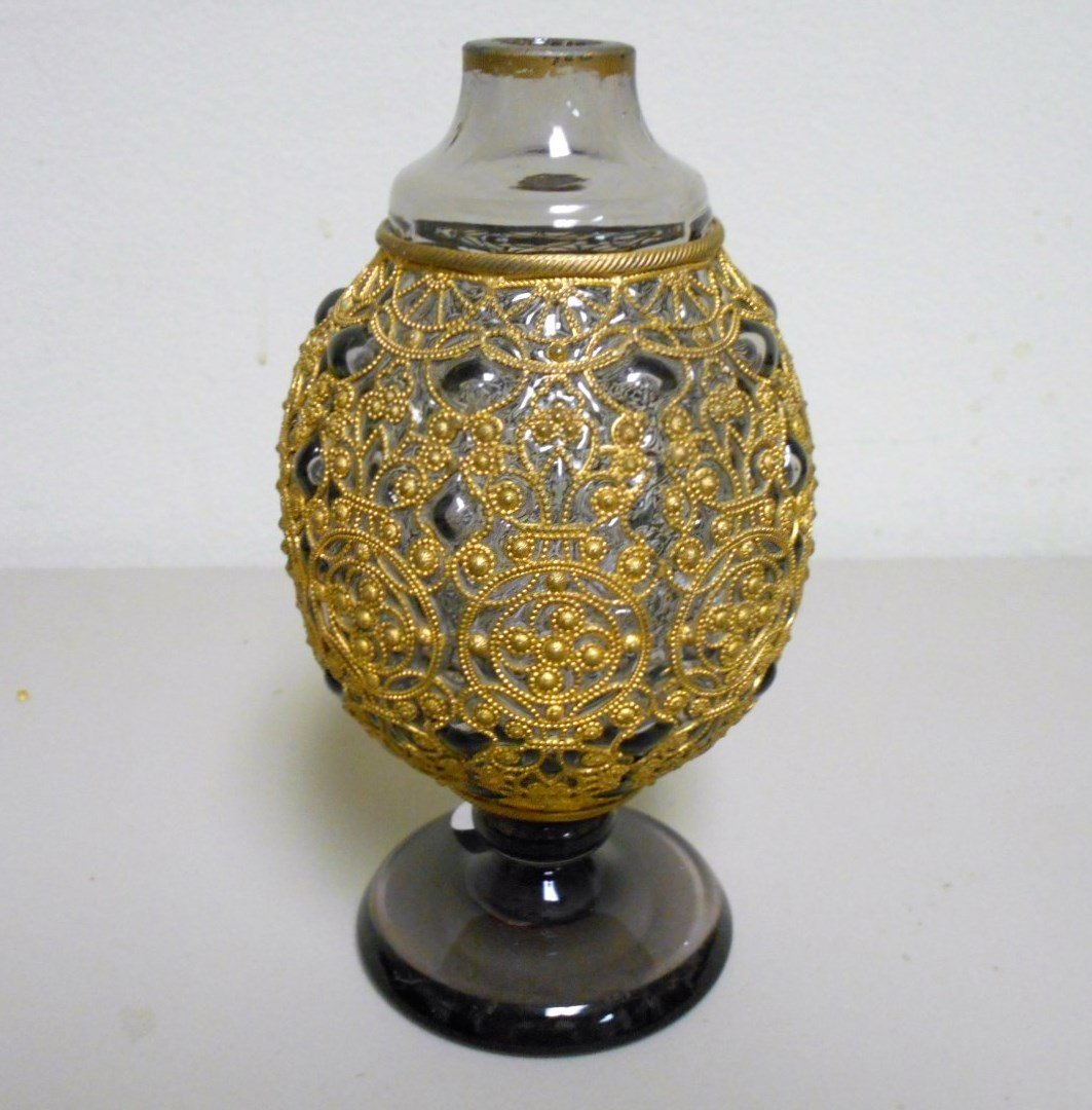Bohemian Vase: 6 1/2" smoky glass Bohemian vase encased in metal armor. Very unique piece ca. 1900 with polished pontil.