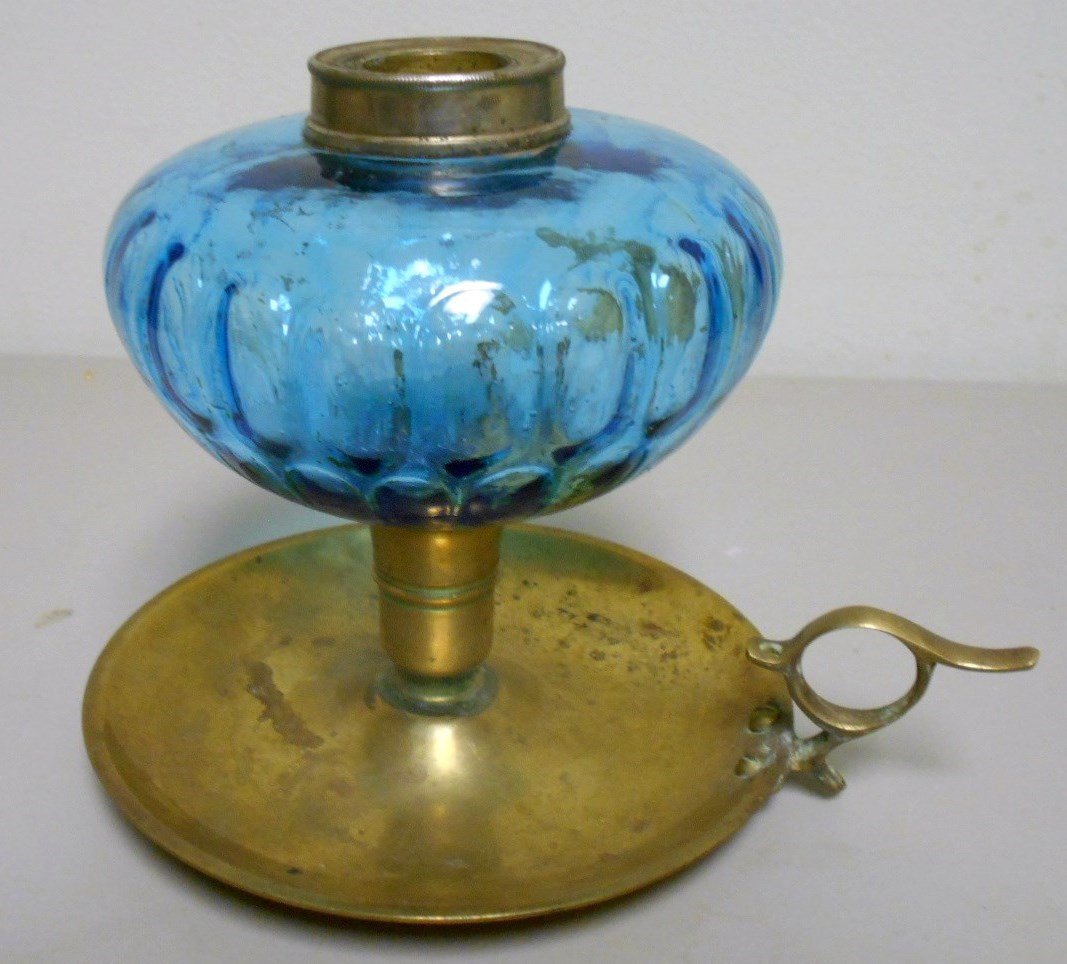 Glass and Brass Oil Lamp: 5 1/2" Whale oil lamp with blue honey comb glass and brass base and finger ring. Ca. 1800's
