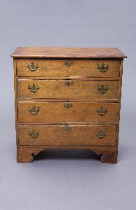 AN AMERICAN COUNTRY PINE CHEST-OF-DRAWERS, 19th ce: AN AMERICAN COUNTRY PINE CHEST-OF-DRAWERS, 19th century. With a rectangular top with rounded corners above four graduated drawers on bracket feet; brass pulls later - 47 1/2 in. x 36 1/2 in. x 20 in.