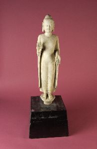 A FINE CHINESE WHITE MARBLE FIGURE OF BUDDHA, In: A FINE CHINESE WHITE MARBLE FIGURE OF BUDDHA, In Qi, circa 1800. Standing wearing long robes, his face carved with a serene expression - H: 23 in.