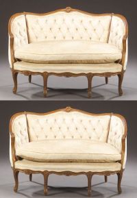A PAIR OF LOUIS XV STYLE CARVED FRUITWOOD SMALL SE: A PAIR OF LOUIS XV STYLE CARVED FRUITWOOD SMALL SETTEES, 20th century. Each with a molded serpentine frame enclosing a tripartite tufted back, bowed seat with loose seat cushion, on cabriole legs; ivo