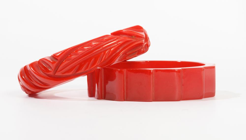TWO RED BAKELITE OR HARD PLASTIC BANGLE BRACELETS, (1 of 1)