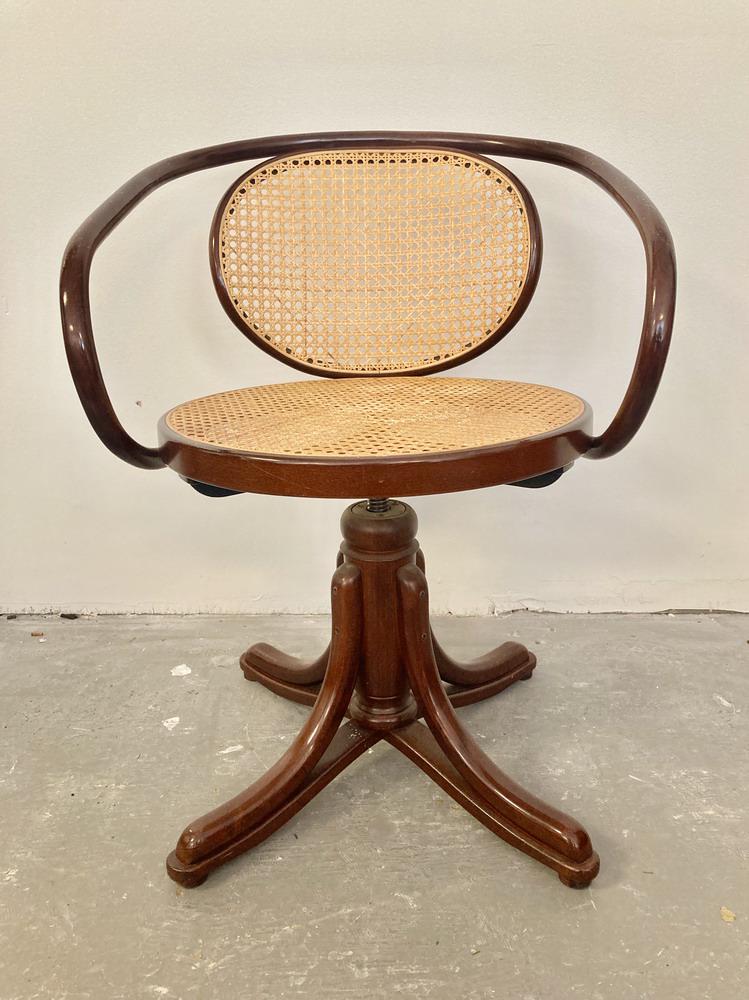 CONTEMPORARY THONET-STYLE BENT WOOD CANED SWIVEL-SEAT: CONTEMPORARY THONET-STYLE BENT WOOD CANED SWIVEL-SEAT CHAIR.