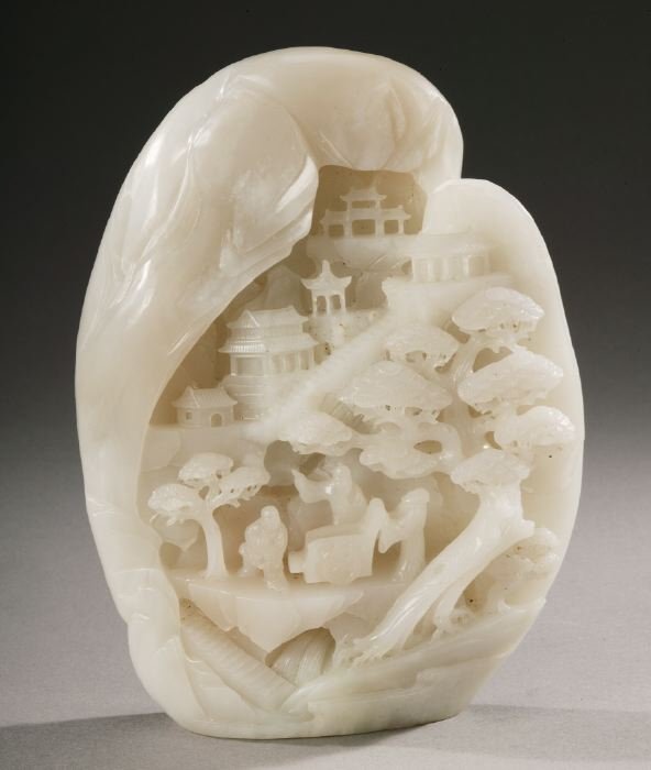 A CHINESE WHITE CARVED JADE BOULDER, lat