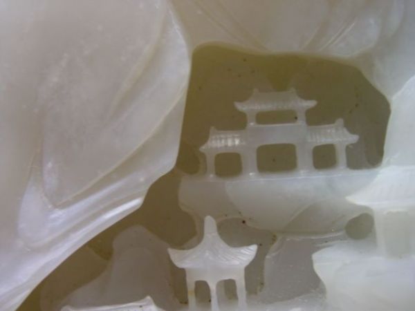 A CHINESE WHITE CARVED JADE BOULDER, lat - 3