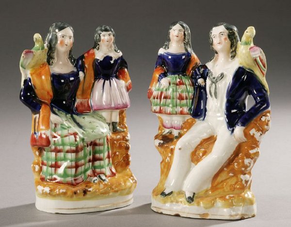A PAIR OF STAFFORDSHIRE EARTHENWARE FIGU