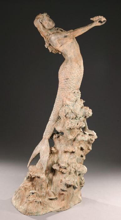 A BRONZE MERMAID AND DOLPHIN FOUNTAIN.: A BRONZE MERMAID AND DOLPHIN FOUNTAIN. The wave-form base encrusted with a turtle, a crab, and various shells - H: 85 in.; D: 38 in.;.