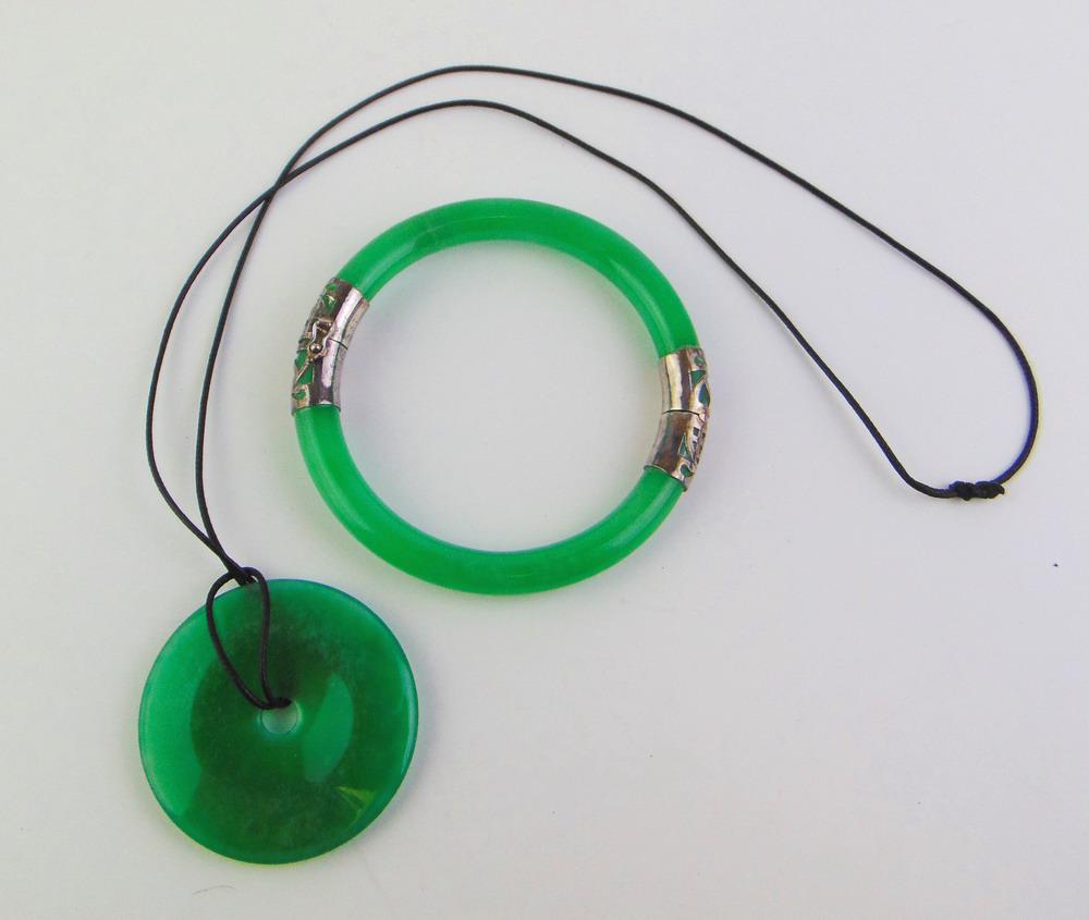 TWO PIECES CHINESE GREEN JADE JEWELRY. "Bi" disc on black pendant cord, D: 1 7/8 in.; and hinged (1 of 4)