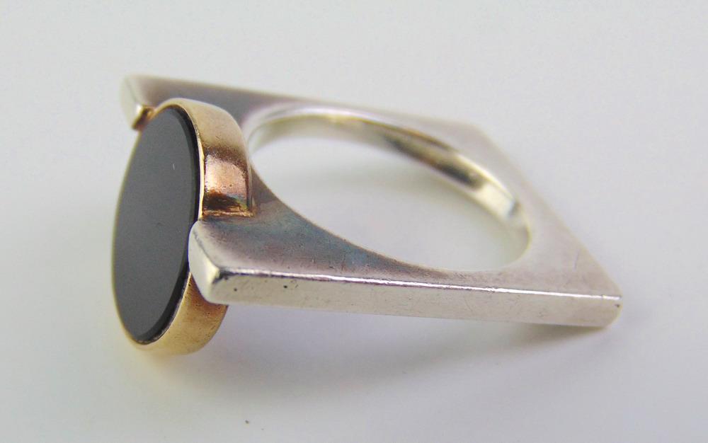 SIGNED PIERRE CARDIN 1960S MODERN STERLING SILVER, 14K YELLOW GOLD, AND BLACK ONYX RING. Circular (1 of 3)