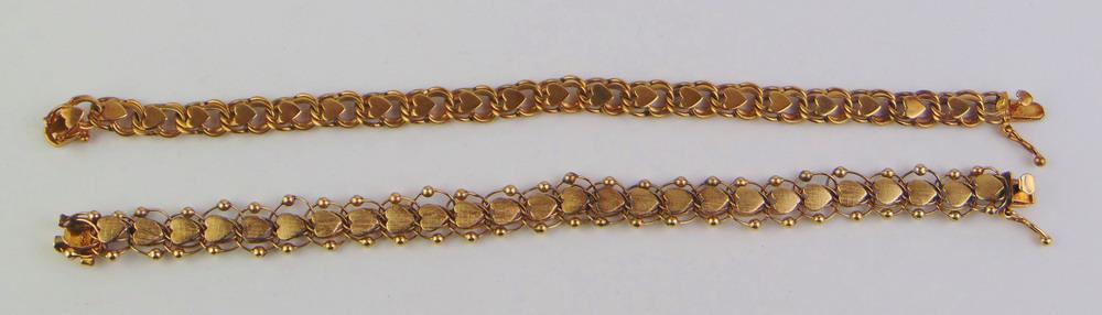 TWO SIMILAR 14K YELLOW GOLD HEART-MOTIF FLEXIBLE LINK BRACELETS.: TWO SIMILAR 14K YELLOW GOLD HEART-MOTIF FLEXIBLE LINK BRACELETS. - 7 in. and 7 1/2 in. Wt. 16 dwt