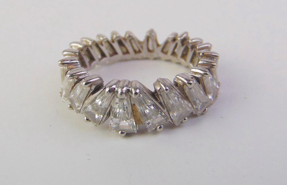 PLATINUM AND DIAMOND GUARD BAND. Circle of 22 diagonally-set, graduated, tapering baguette diamonds (1 of 3)