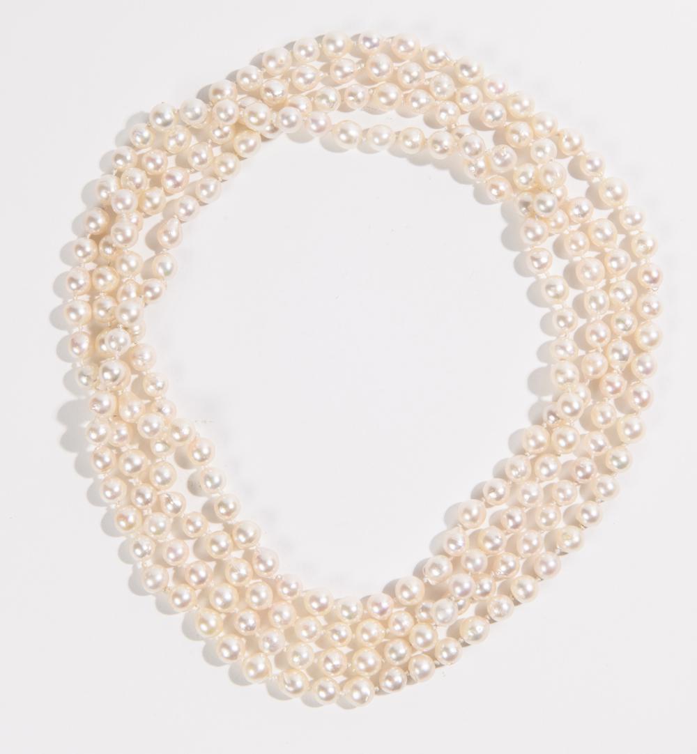 "ENDLESS" STRAND SEMI-BAROQUE PEARL NECKLACE. - L: 70 in.: "ENDLESS" STRAND SEMI-BAROQUE PEARL NECKLACE. 6.5- 7mm pearls - L: 70 in.