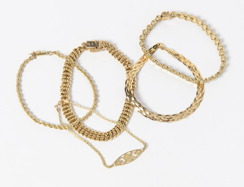 FIVE ASSORTED YELLOW GOLD FLEXIBLE LINK BRACELETS.: FIVE ASSORTED YELLOW GOLD FLEXIBLE LINK BRACELETS. Including two 18K braided strap and oval chain link, wt. 10 dwt.; and three 14K, wt. 10 dwt.