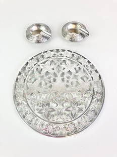 WEBSTER CO. STERLING OVERLAY COLORLESS GLASS TRIVET AND PAIR STERLING INDIVIDUAL ASHTRAYS,: WEBSTER CO. STERLING OVERLAY COLORLESS GLASS TRIVET AND PAIR STERLING INDIVIDUAL ASHTRAYS. Trivet, D: 6 in. Ashtrays, wt. 1 oz