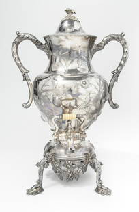 LATE 19TH CENTURY SILVERPLATED HOT-WATER/TEA URN WITH FLORAL CHASED AND STRAWBERRY DECORATION. - H:: LATE 19TH CENTURY SILVERPLATED HOT-WATER/TEA URN WITH FLORAL CHASED AND STRAWBERRY DECORATION. On stand with four cabriole legs ending in leafy feet - H: 17 in.