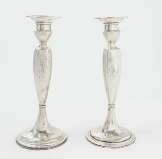 TWO PAIRS WEIGHTED STERLING SILVER CANDLEHOLDERS,: TWO PAIRS WEIGHTED STERLING SILVER CANDLEHOLDERS. Including pair Gorham Co. paneled baluster-form, H: 8 3/4 in., and pair International Co. "Wild Rose" console candlesticks with matching weighted