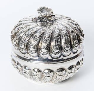 TURKISH SILVER (900-FINE) MELON-REEDED ROUND LIFT-TOP BOX, circa 1975.: TURKISH SILVER (900-FINE) MELON-REEDED ROUND LIFT-TOP BOX, circa 1975. Swirled lobes of relief floral decoration; fully sculpted flowerhead finial; vermeil interior. H: 6 in.; D: 6 in.; Wt. 14 troy