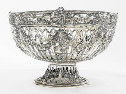 CONTINENTAL SILVER (800-FINE) FLORAL REPOUSSE OPEN-WORK PEDESTAL-BASE BOWL. late 19th century.: CONTINENTAL SILVER (800-FINE) FLORAL REPOUSSE OPEN-WORK PEDESTAL-BASE BOWL. late 19th century. Swags of floral and musical instrument decoration. H: 6 in.; D: 9 5.8 in. Wt. 21.4 troy oz.