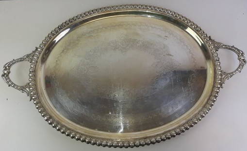 HEAVY SILVER-PLATED OVAL TWO-HANDLE SERVING TRAY: HEAVY SILVER-PLATED OVAL TWO-HANDLE SERVING TRAY. late 19th-early 20th century, Chased center; leafy egg-and-dart borderL: 26 in.