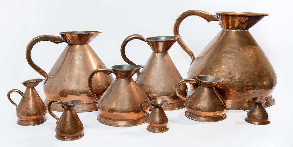SET OF EIGHT GRADUATED COPPER MEASURES AND AN ADDITIONAL MEASURE. Tallest, H: 16 in.; smallest, H: 3 (1 of 1)