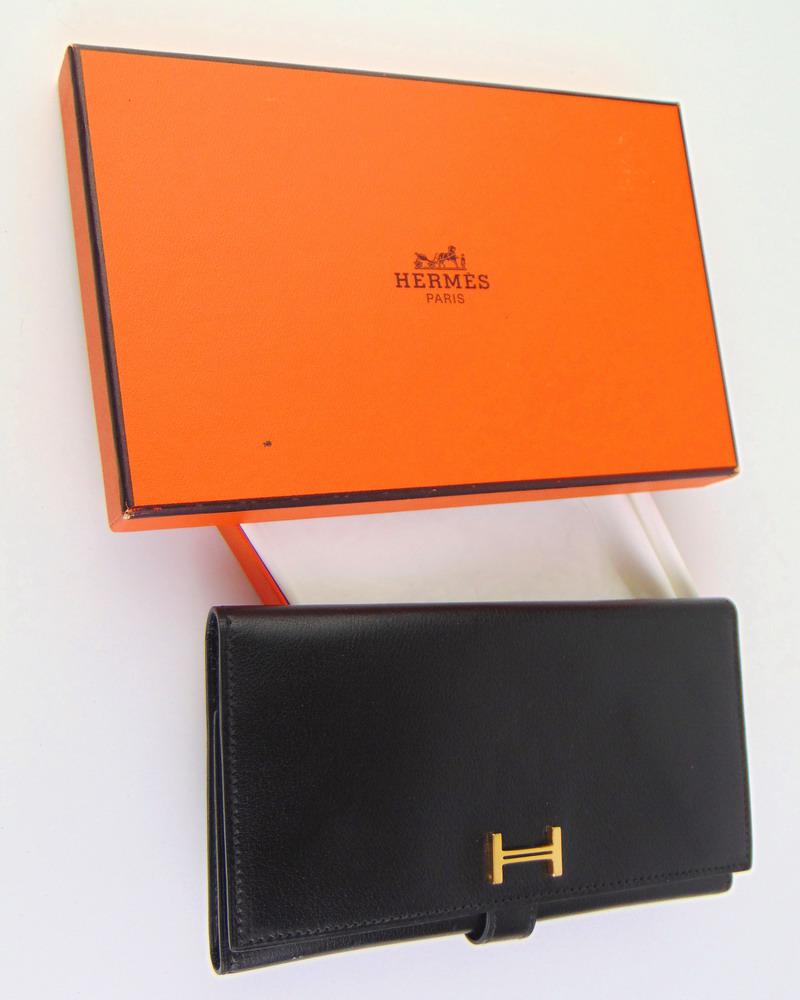 HERMES BLACK LEATHER THREE-FOLD WALLET, NEW, IN ORIGINAL STAMPED ORANGE PRESENTATION BOX. (1 of 6)