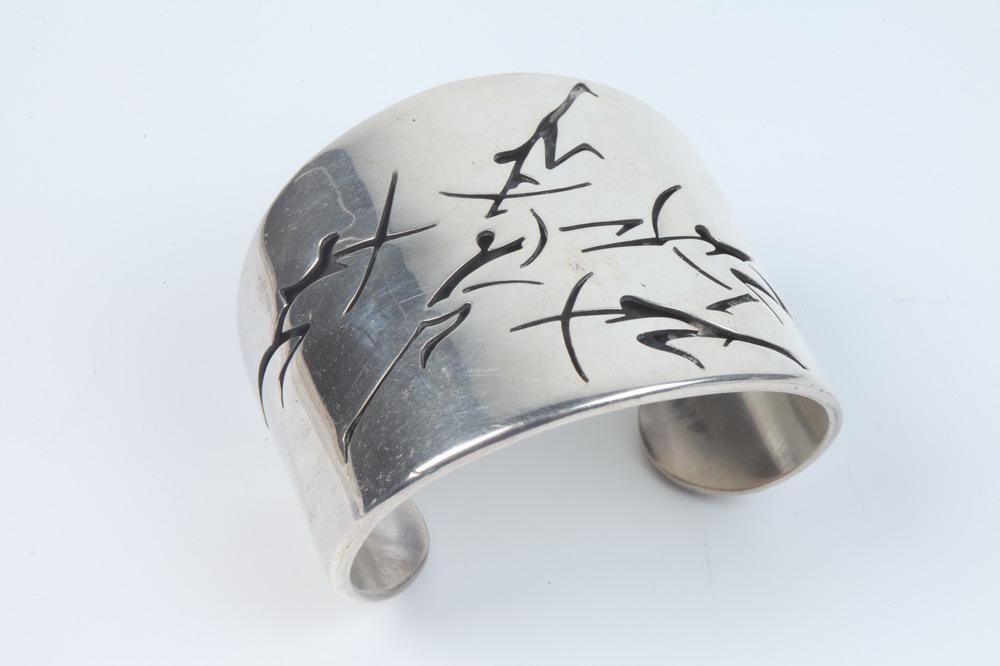 MID-CENTURY MODERN MEXICAN STERLING SILVER WIDE, TAPERING OPEN-END CUFF BRACELET WITH CUT-OUT MOTIF (1 of 4)