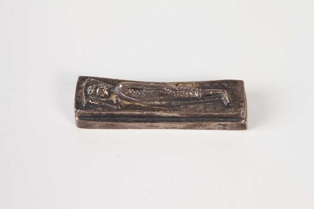 ANTIQUE MINIATURE SILVER FIGURE OF RECLINING BUDDHA OR PHAROAH ON RECTANGULAR PALLET, - L: 2 1/4 in. (1 of 1)