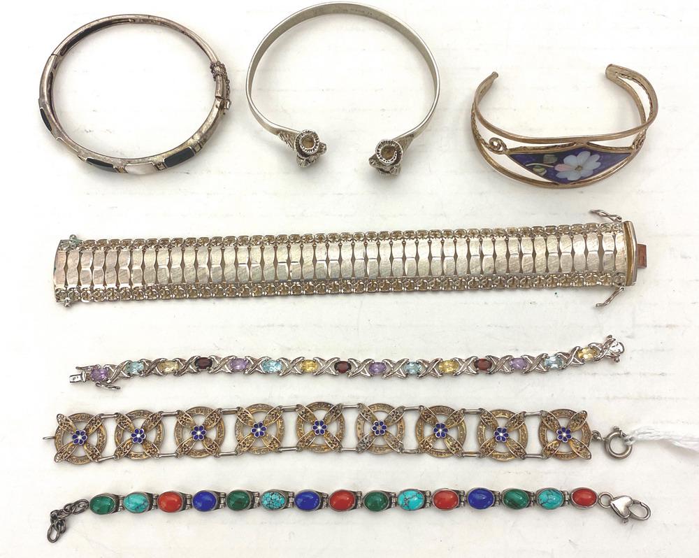 SEVEN ASSORTED STERLING SILVER BRACELETS, SOME WITH COLORED HARDSTONE ACCENTS. (1 of 1)