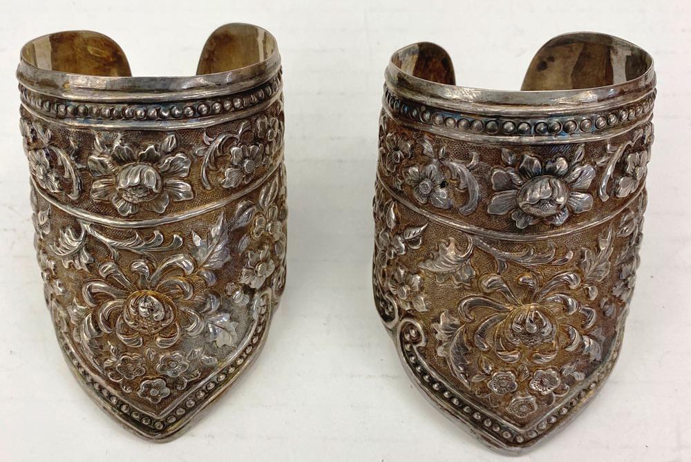 PAIR CHINESE SILVER FLORAL REPOUSSE SHAPED, WIDE CUFF BRACELETS. (1 of 1)