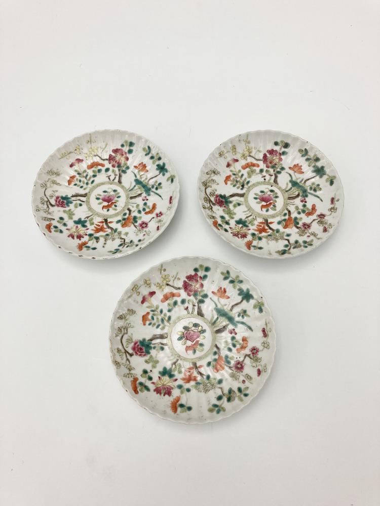 THREE CHINESE FAMILLE ROSE PORCELAIN PLATES. - D: 5 3/4".: THREE CHINESE FAMILLE ROSE PORCELAIN PLATES. Melon-seed with shaped rims; florals, peach and bat decoration. - D: 5 3/4".