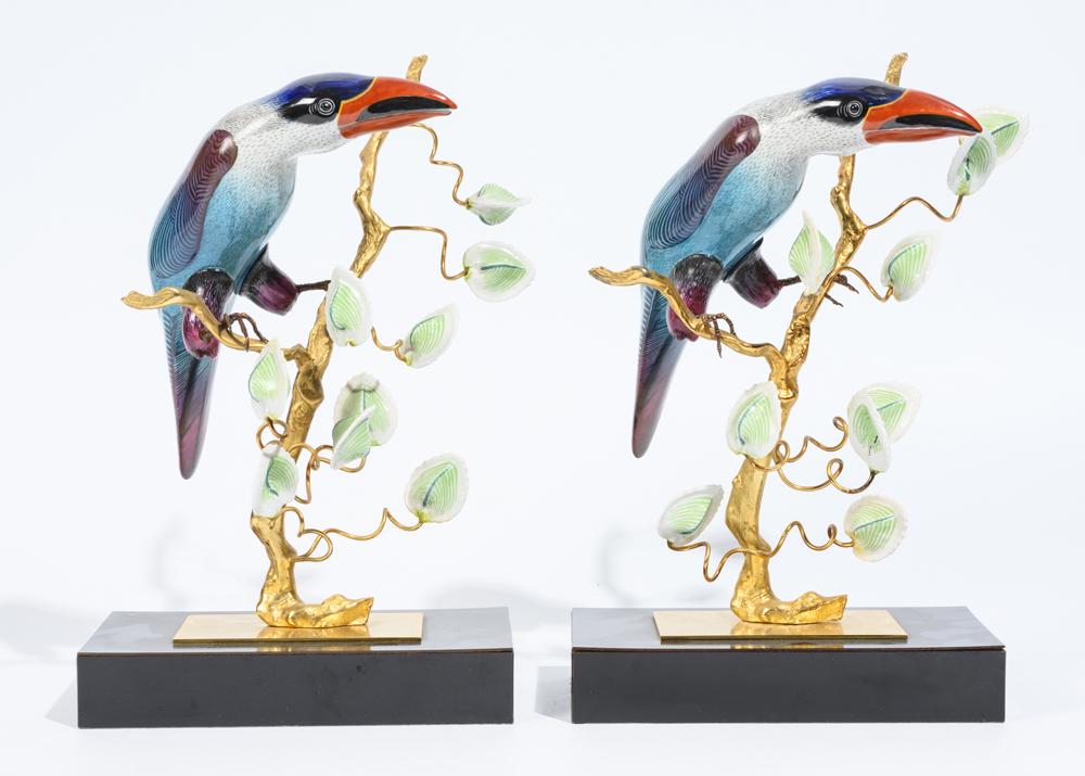 PAIR PAINTED PORCELAIN AND GILT METAL FIGURINES OF TROPICAL BIRDS PERCHED ON FLOWERING BRANCHES, - (1 of 1)