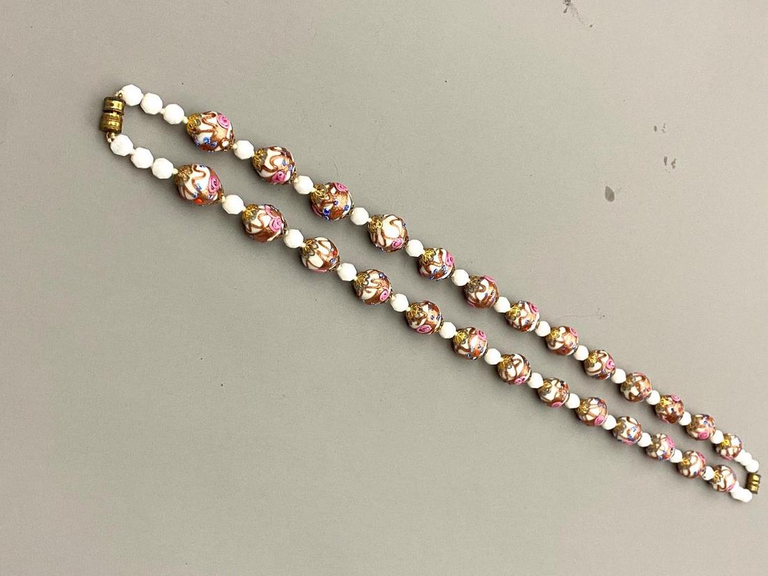 PAIR 1930'S VENETIAN MURANO WEDDING CAKE BEAD CHOKERS, - Each, L: 17"; screw together to form 34": PAIR 1930'S VENETIAN MURANO WEDDING CAKE BEAD CHOKERS. White beads hand-painted with gilt and applied pink flower motifs. - Each, L: 17"; screw together to form 34" necklace.