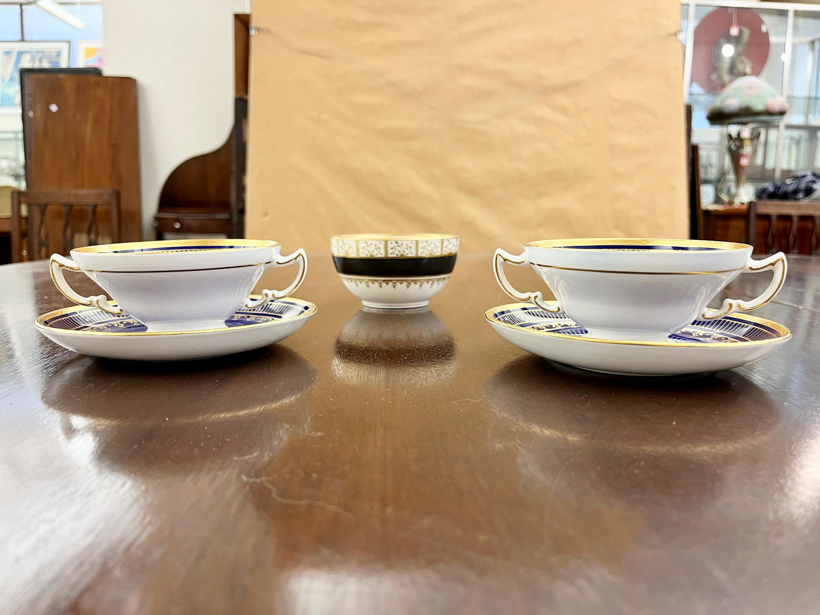 SET TWELVE MINTONS COBALT AND GILT PORCELAIN TWO-HANDLE BOUILLON BOWLS AND SAUCERS, Retailed by (1 of 14)
