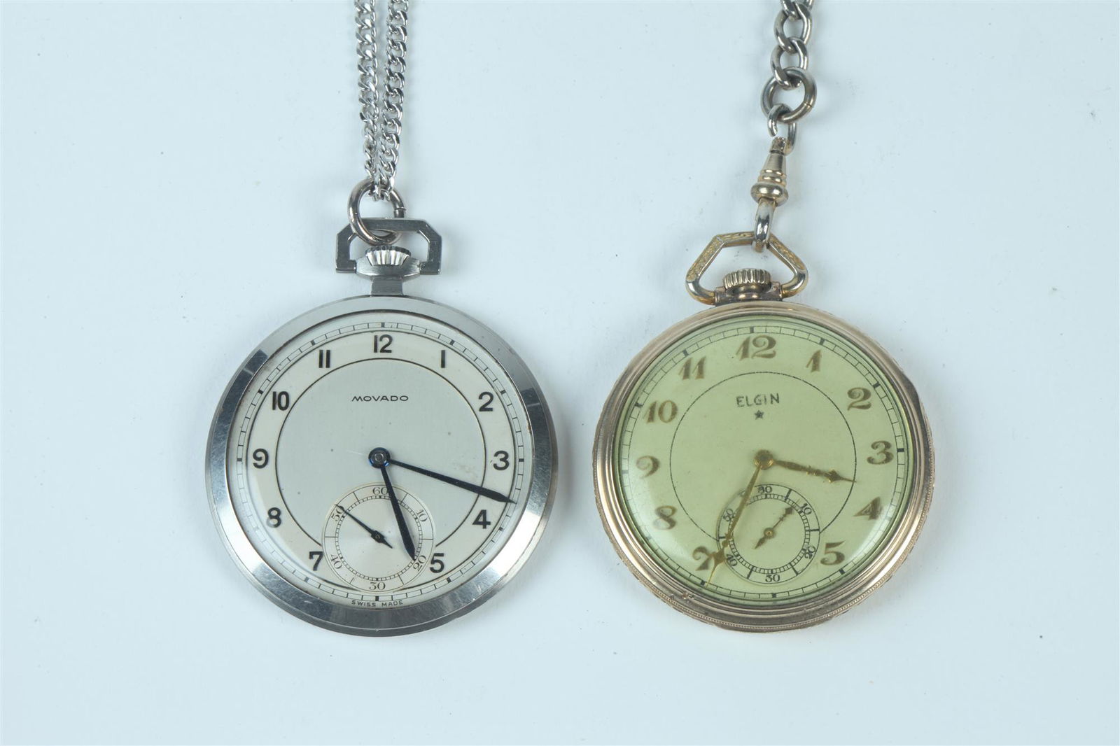 TWO OPEN-FACE POCKET WATCHES ON CHAINS. early to mid 20th century, One, yellow gold plated Elgin; (1 of 1)
