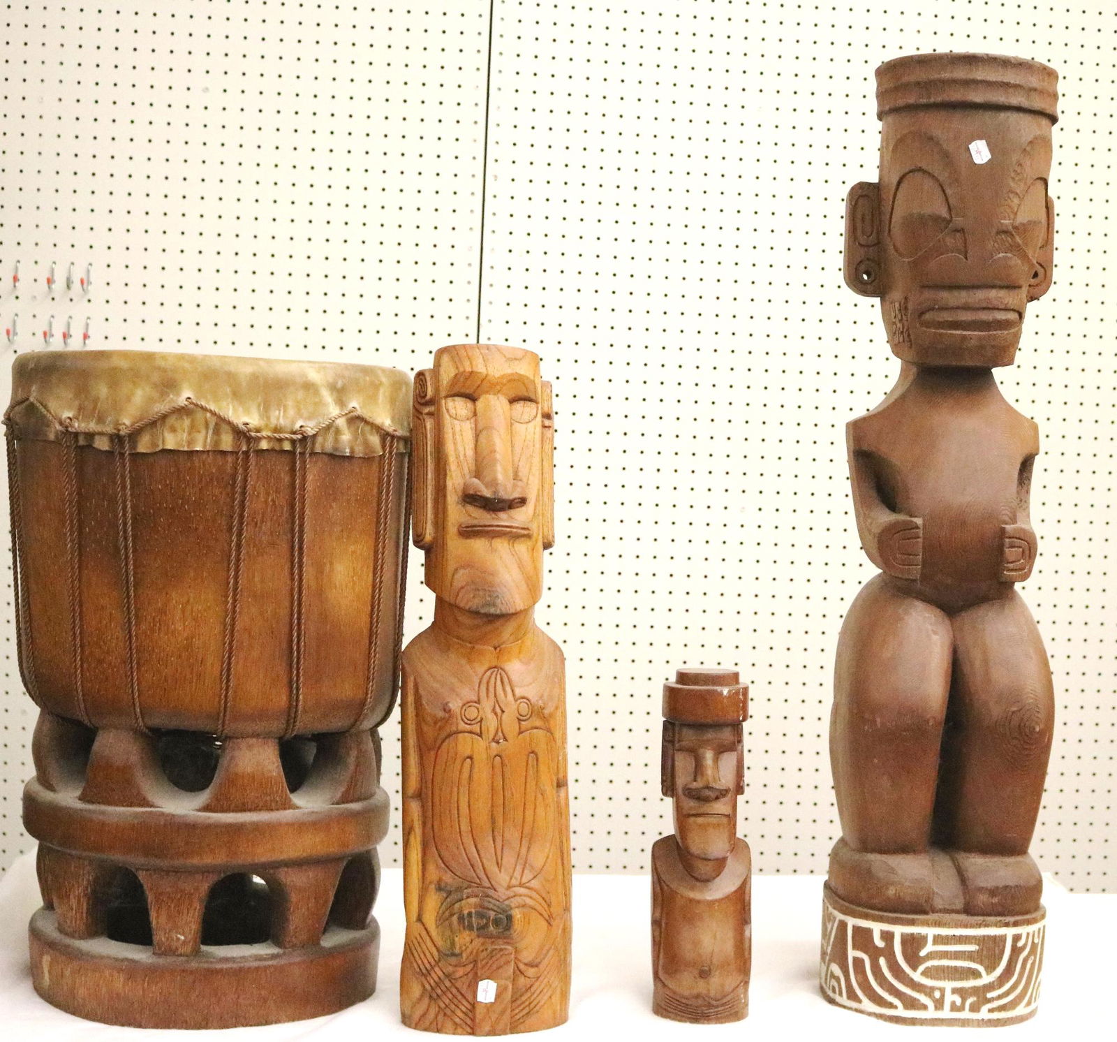 TWO EASTERN ISLAND DECORATIVE STATUES, A DRUM AND AN POLYNESIAN STATUE, 20th century. - height: 35 (1 of 7)
