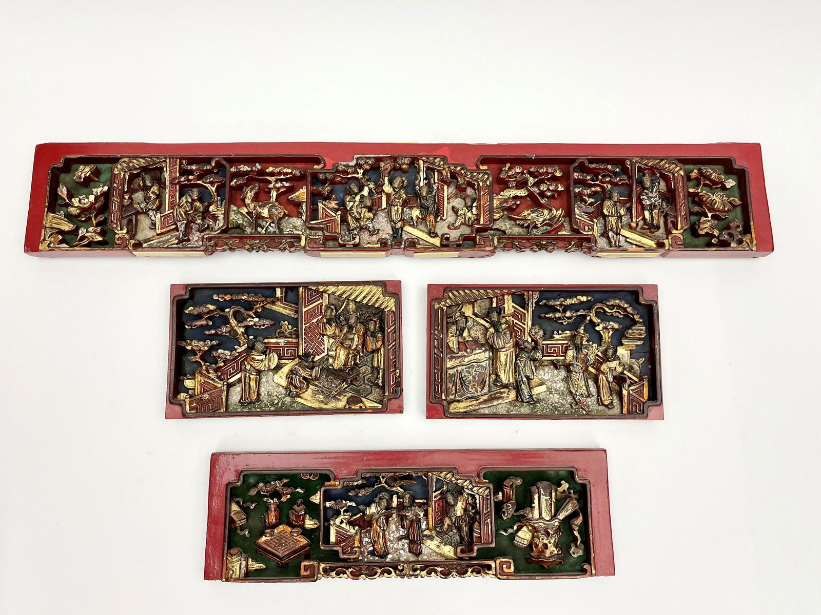 FOUR CHINESE FIGURAL-CARVED GILTWOOD AND RED LACQUER RECTANGULAR TEMPLE PANELS, - Largest, 5 1/8 in. (1 of 13)