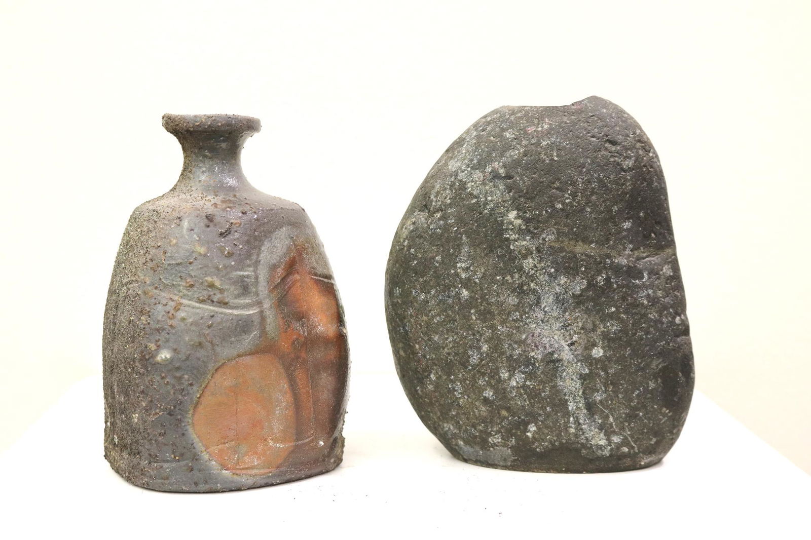 TWO CONTEMPORARY JAPANESE VESSELS. One, hollowed stone vase, H: 5 1/4 in. and studio pottery (1 of 9)