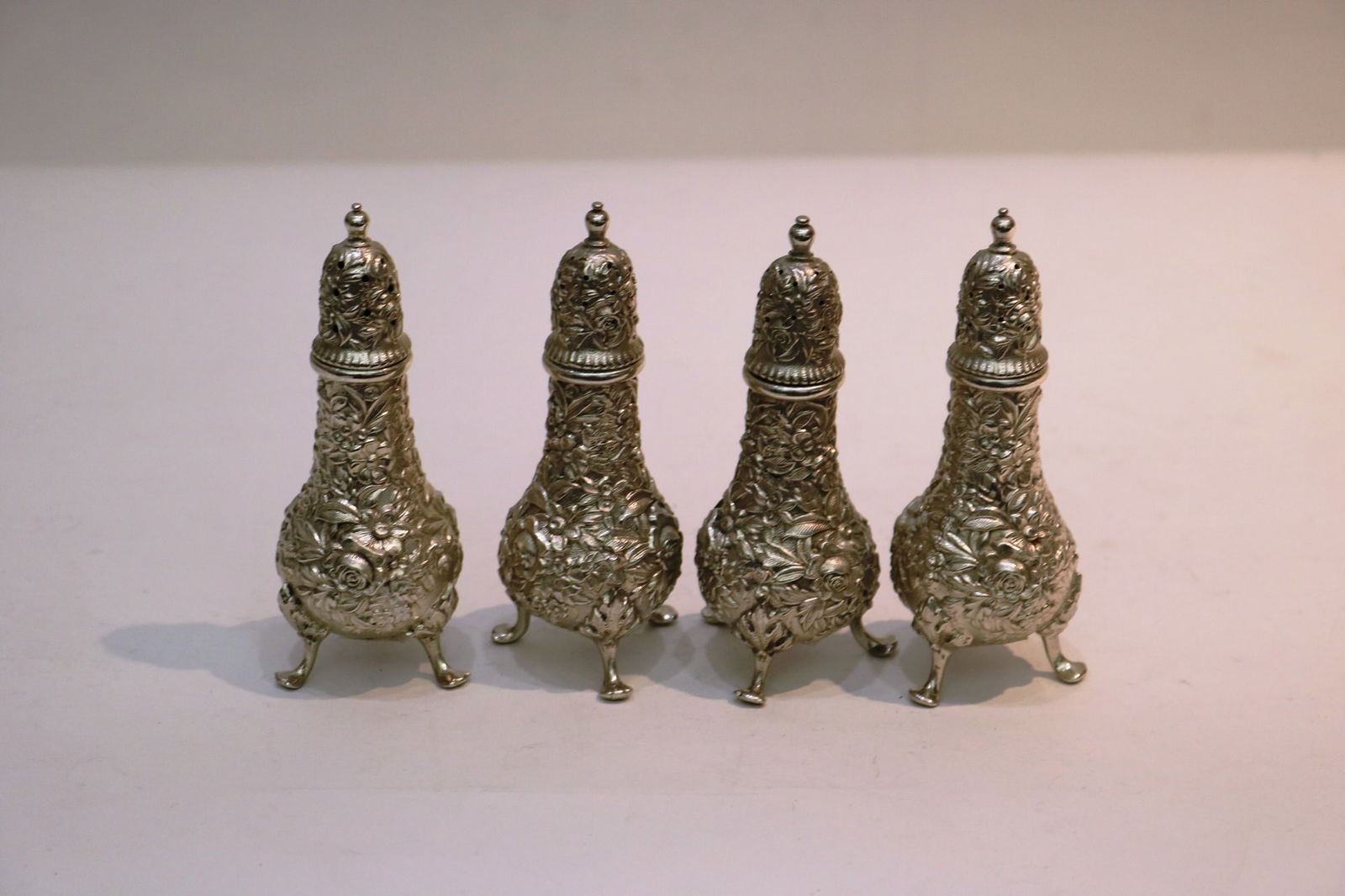 SET FOUR S. KIRK & SON STERLING SILVER "FLORAL REPOUSSE" BALUSTER-FORM, FOOTED SALT AND PEPPER (1 of 8)