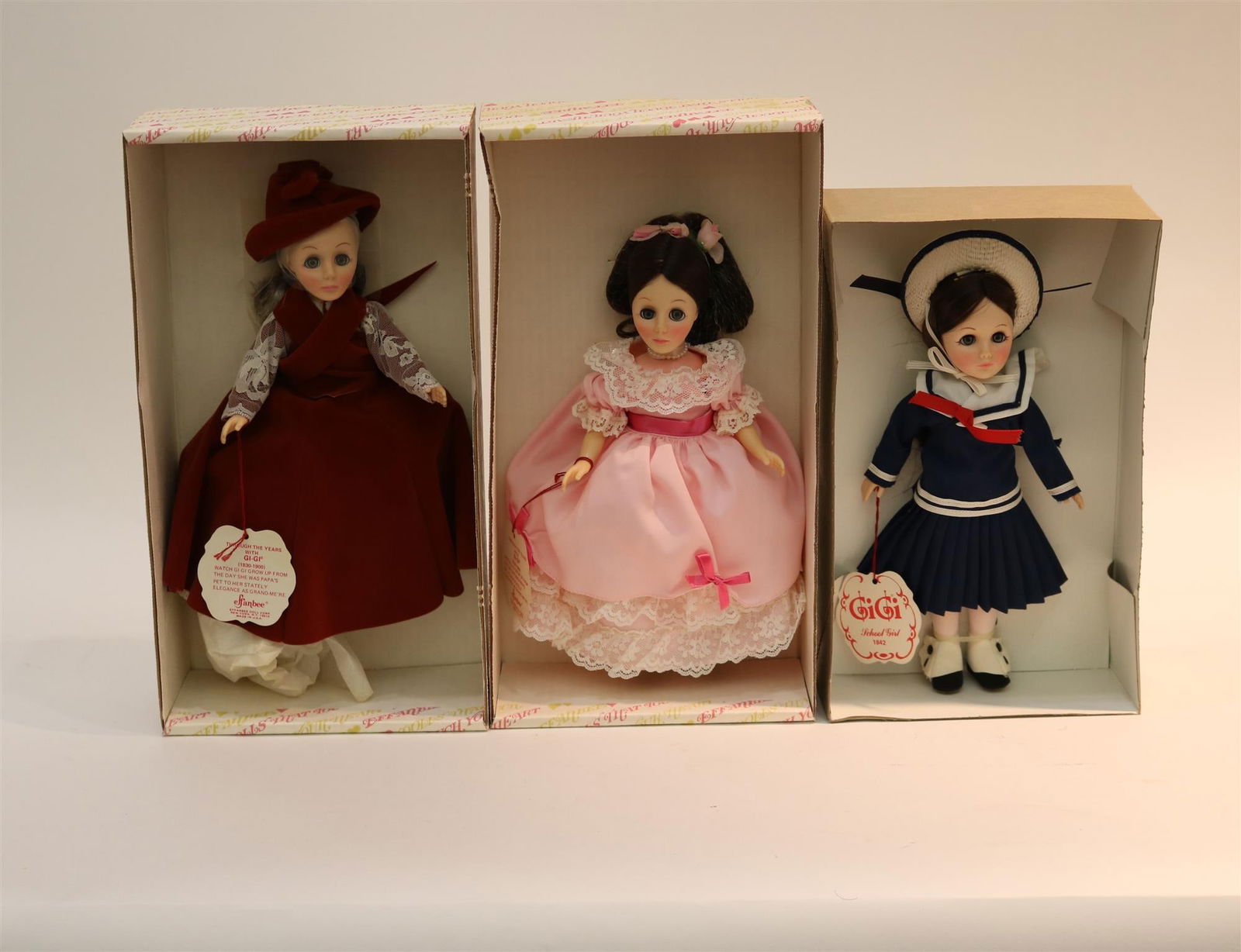 THREE EFFANBEE HARD PLASTIC DOLLS FROM THE "GIGI" SERIES, #1162, #1264 and #1266.: THREE EFFANBEE HARD PLASTIC DOLLS FROM THE "GIGI" SERIES, #1162, #1264 and #1266. All in original boxes."School Girl", "Femme Fatale" and "Grand Mere"