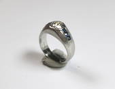 SIGNED TIFFANY & CO. ART DECO PLATINUM, DIAMOND AND SAPPHIRE LOW DOME RING, early 20th century.