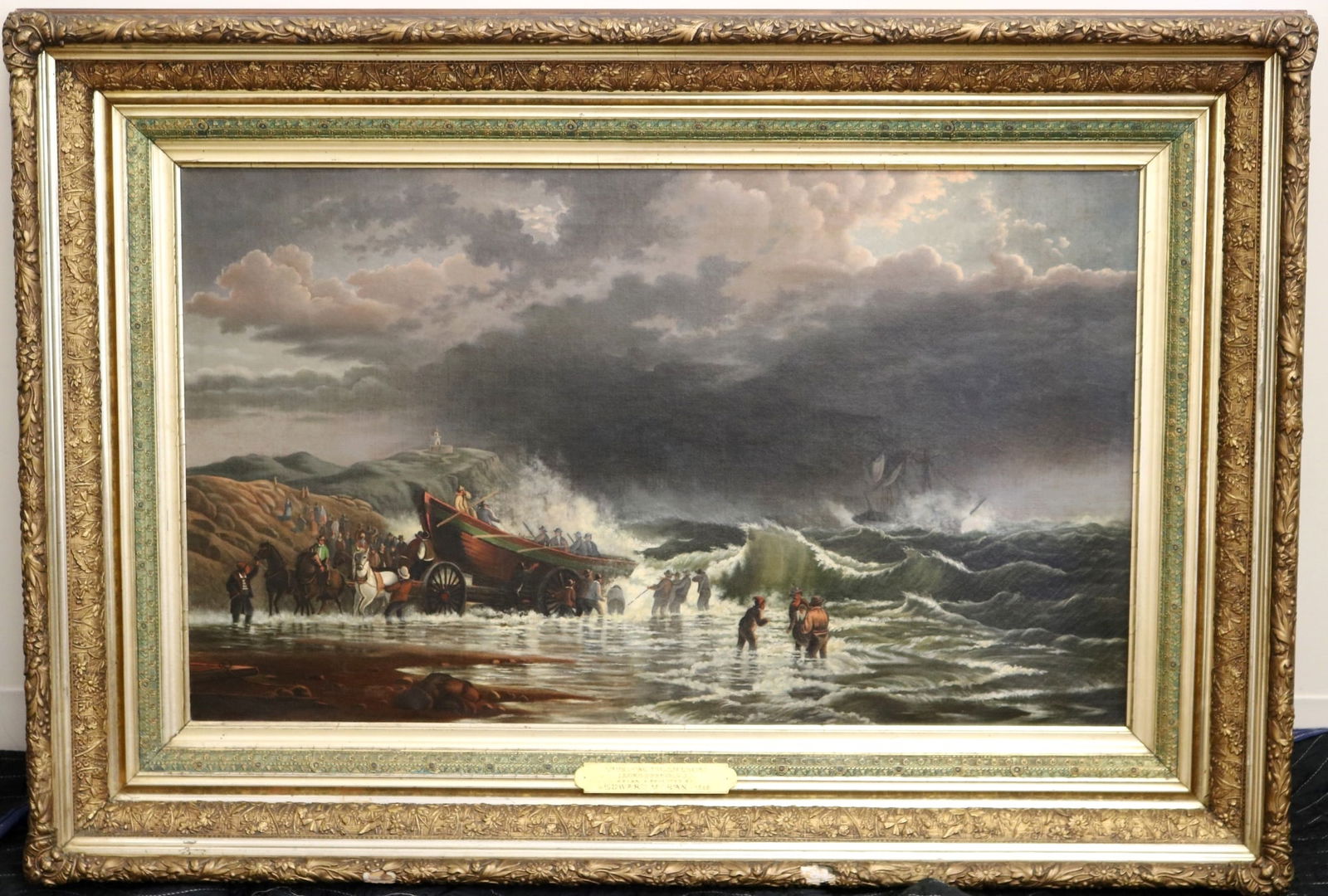 FOLLOWER OF EDWARD MORAN (American, 1829 - 1901). Launching the Lifeboat, 1868, Oil on canvas of a: FOLLOWER OF EDWARD MORAN (American, 1829 - 1901). Launching the Lifeboat, 1868, Oil on canvas of a shore scene with crashing waves, a horse-drawn boat carrier and towns-people, a ship in distress offs