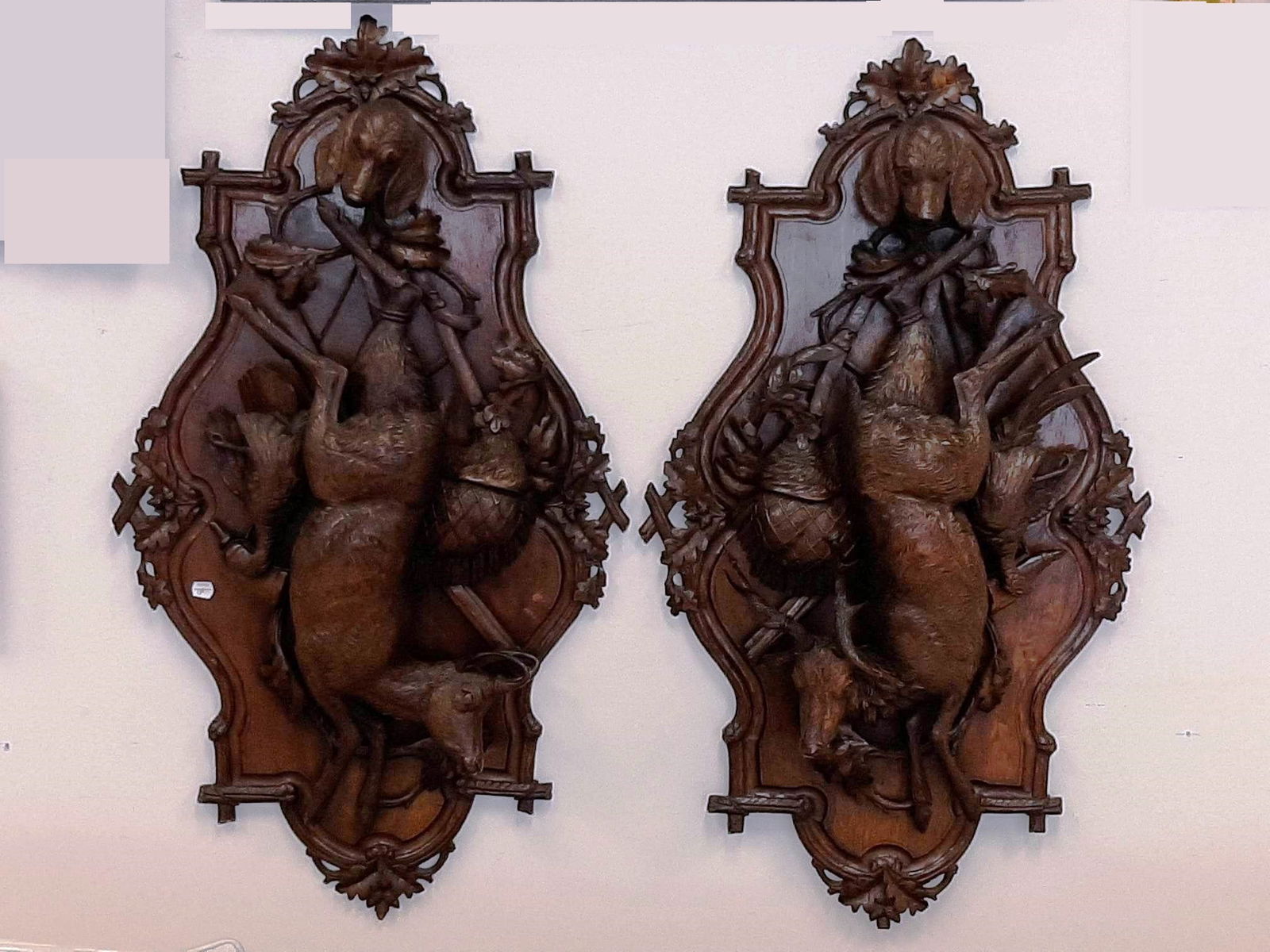 PAIR BAVARIAN CARVED WALNUT PLAQUES OF HANGING GAME, 19th century. - H: 38 in. W: 21 in. (1 of 11)