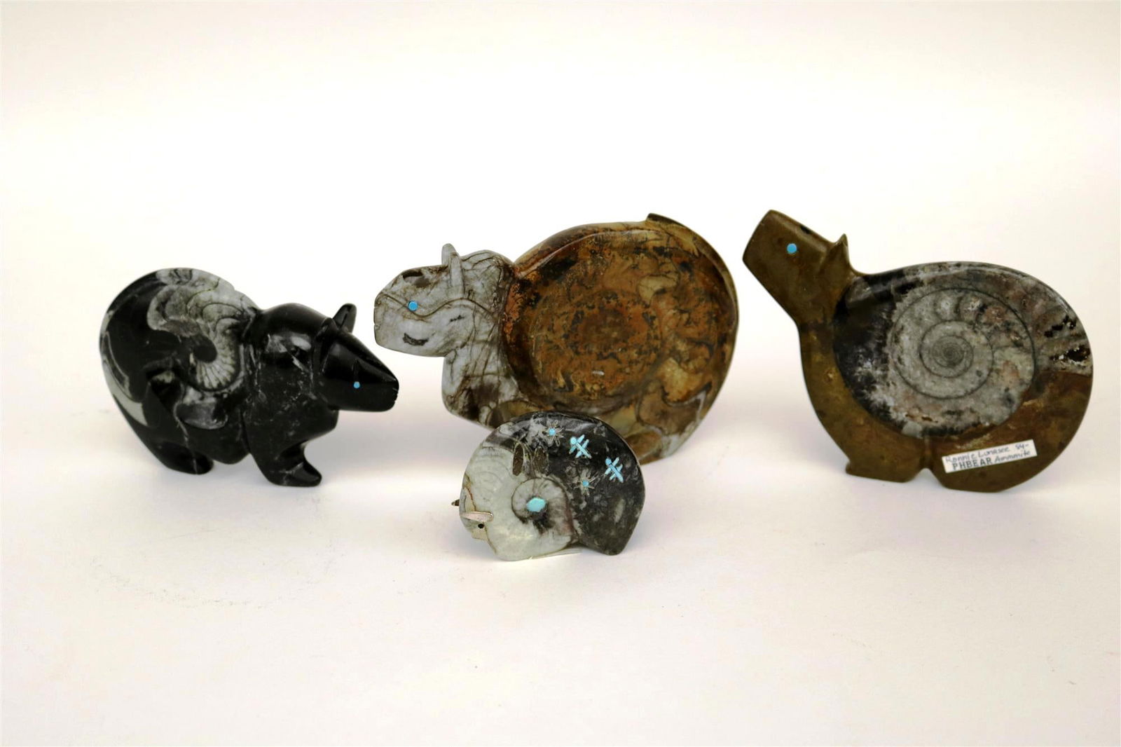 FOUR NATIVE AMERICAN CARVINGS.: FOUR NATIVE AMERICAN CARVINGS. Selection of four Native American small-sized carvings. Most carvings depict animals; materials used include jet, shell, coral, and travertine, fishrock, jasper, pipest