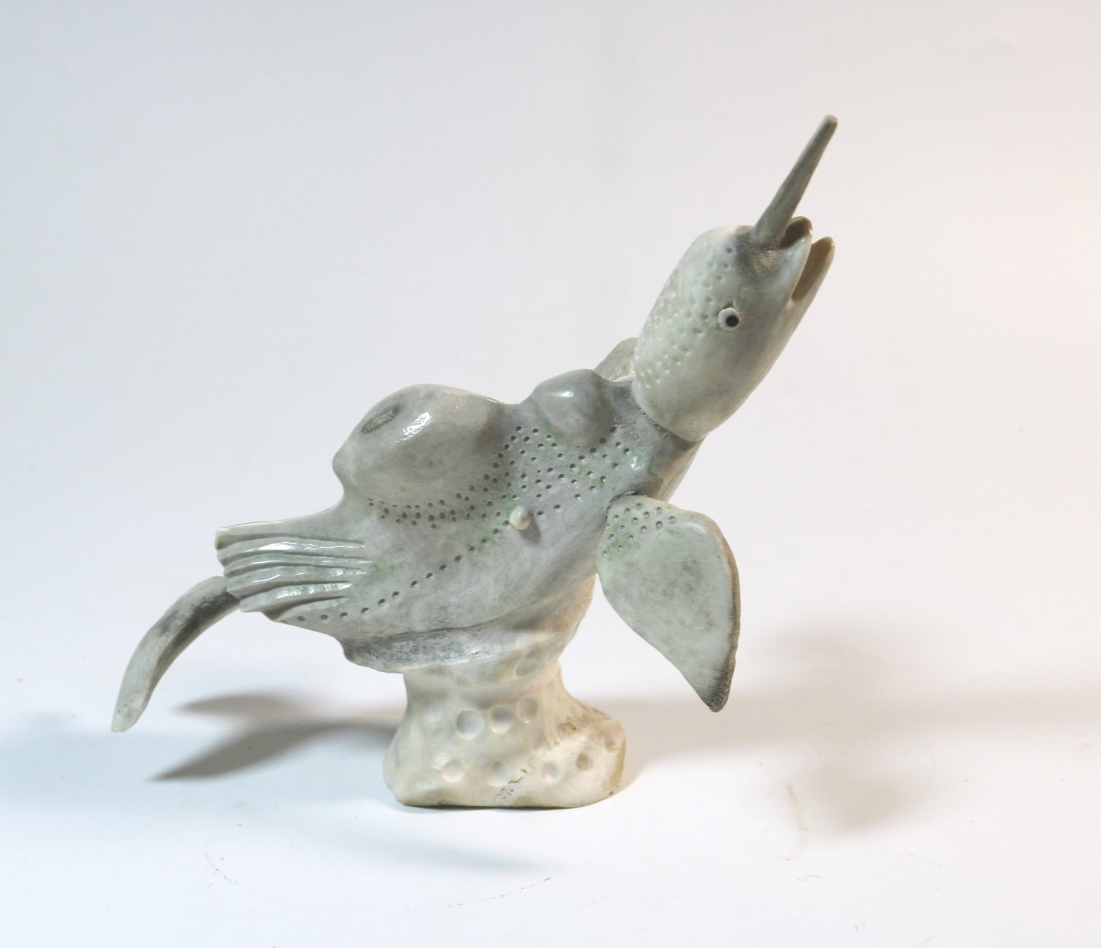 DAVID ETOOK (Canadian, born 1929). Transformation, 1993, Hand carved bone sculpture of a: DAVID ETOOK (Canadian, born 1929). Transformation, 1993, Hand carved bone sculpture of a transformation between a bird and a whale. With Ref (26)-7-3347. Acquired in 2003 at "Tookalook Native Arts" (Q