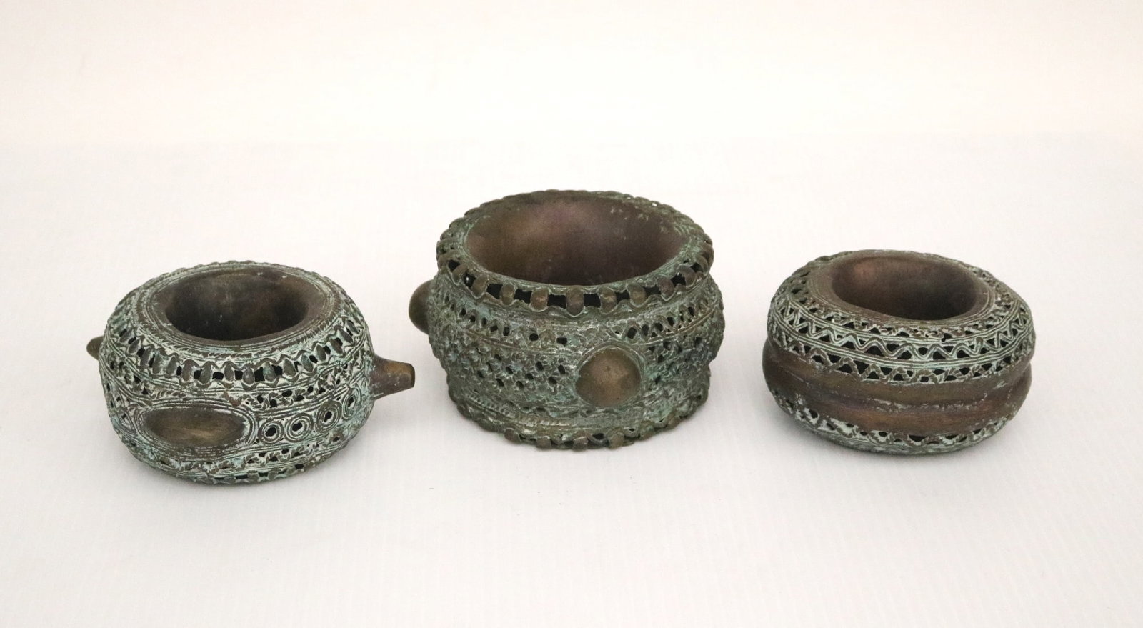 THREE BENIN NIGERIA BRONZE CURRENCY BRACELETS, 20th century. - variable diameter; 5.5 inches. (1 of 18)