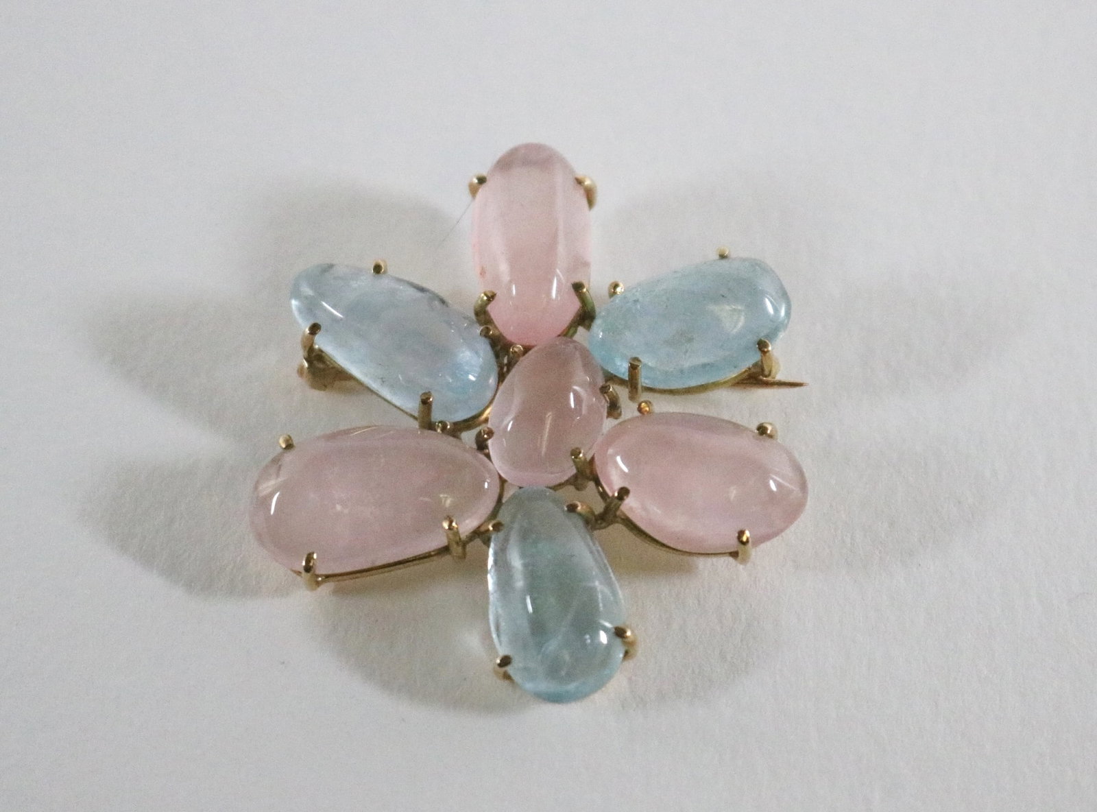 CUSTOM-MADE YELLOW GOLD, ROSE QUARTZ AND AQUAMARINE CABOCHON STYLIZED FLOWERHEAD DESIGN,: CUSTOM-MADE YELLOW GOLD, ROSE QUARTZ AND AQUAMARINE CABOCHON STYLIZED FLOWERHEAD DESIGN, by Willis & Sons, Bar Harbor, Maine, Asymetrical, whimsical flowerhead with six petals alternately of rose quar