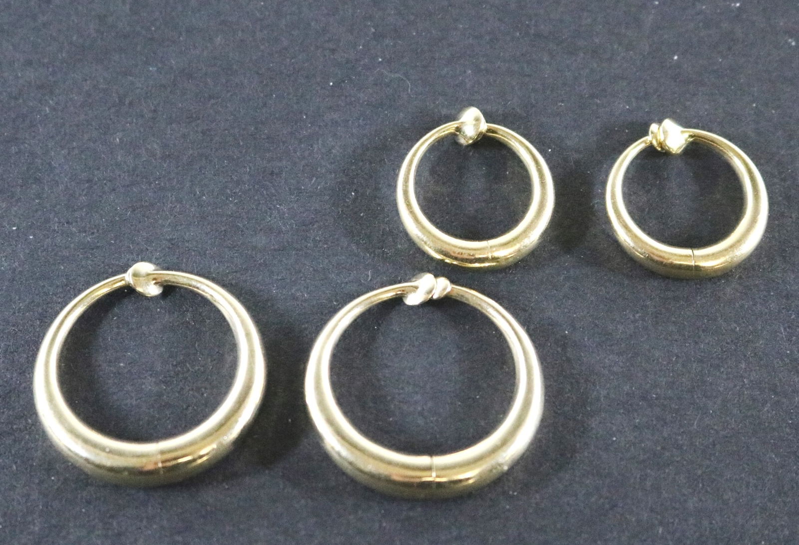 TWO PAIRS 14K BRIGHT-POLISHED YELLOW GOLD CIRCULAR HOOP EARRINGS. (1 of 7)