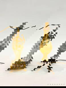 TWO ART GLASS TABLE LAMP BASES. - Taller, H: 13", overall.: TWO ART GLASS TABLE LAMP BASES. One, gold favrile with threaded decoration; other, Steuben with cream ground with stylized gold branches and leaves; metal mounts. - Taller, H: 13", overall.