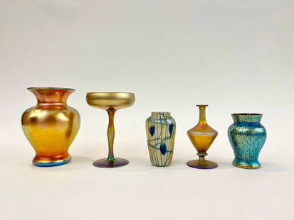 FIVE PIECES IRIDESCENT ART GLASS. early 20th century.: FIVE PIECES IRIDESCENT ART GLASS. early 20th century. Including Steuben gold aurene baluster-form vase. H: 6 1/2"; aurene long-stemmed goblet numbered "2642"; aurene pedestal base vase numbered "3175"